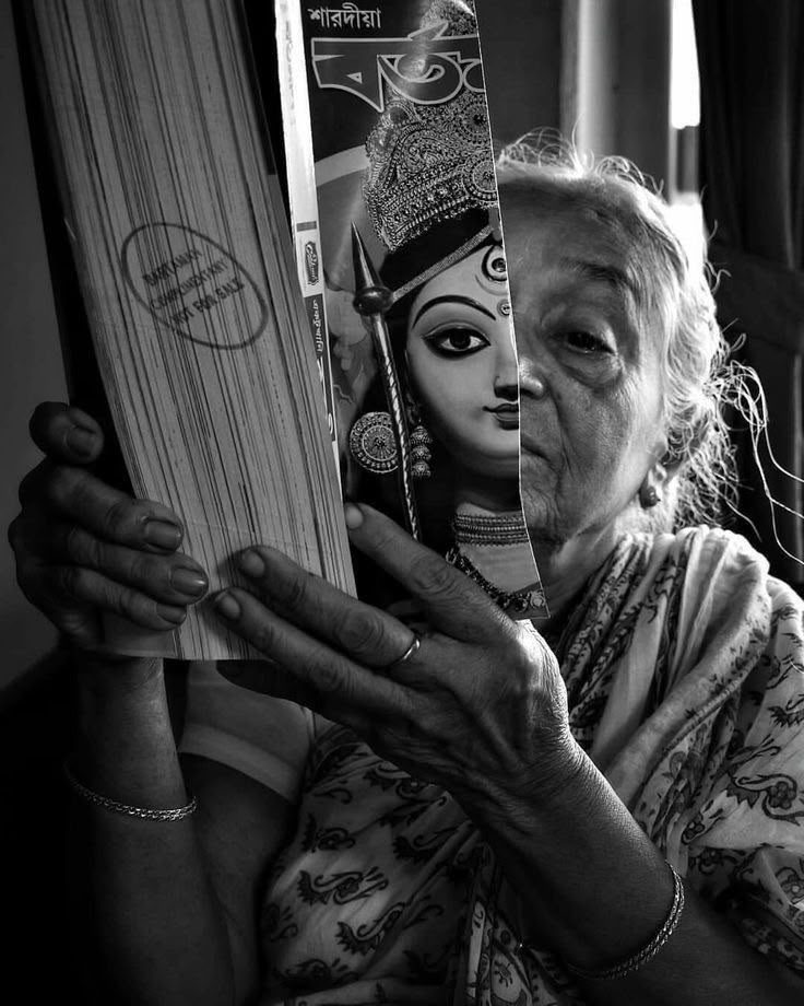 An elderly Bengali grandmother whose face gently merges with the face of the goddess Durga.